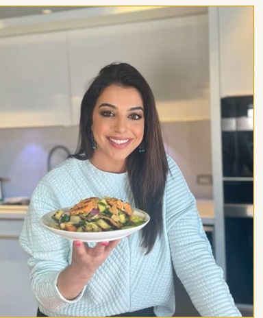 Samira Ardalan holding a plated salad